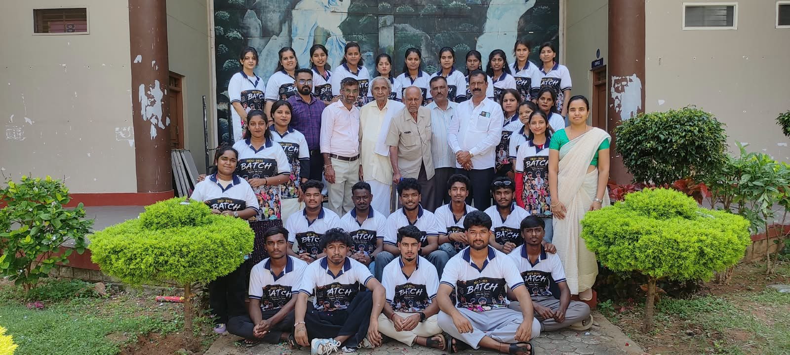 College students and staff gathered for a group photograph outside the campus building